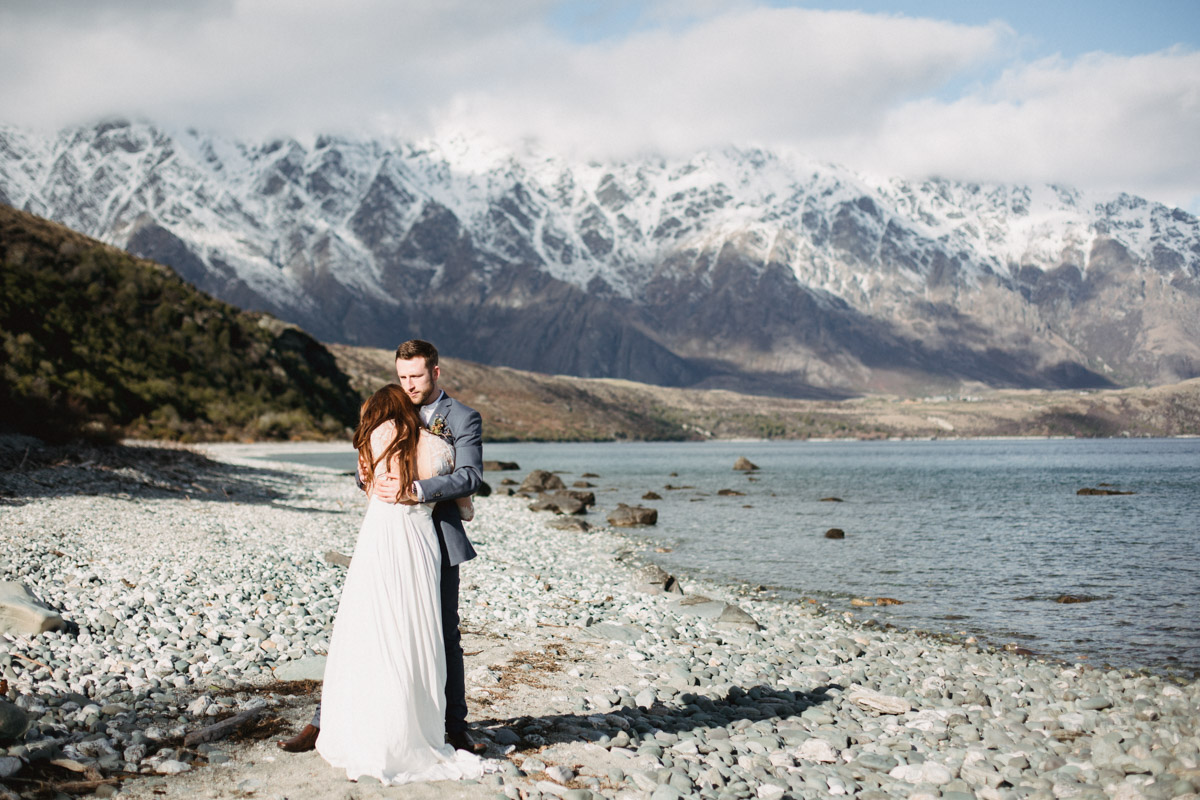 Bride and Groom at their wild romantic Queenstown lake Wakatipu lakeside wedding by Dawn Thomson Photography