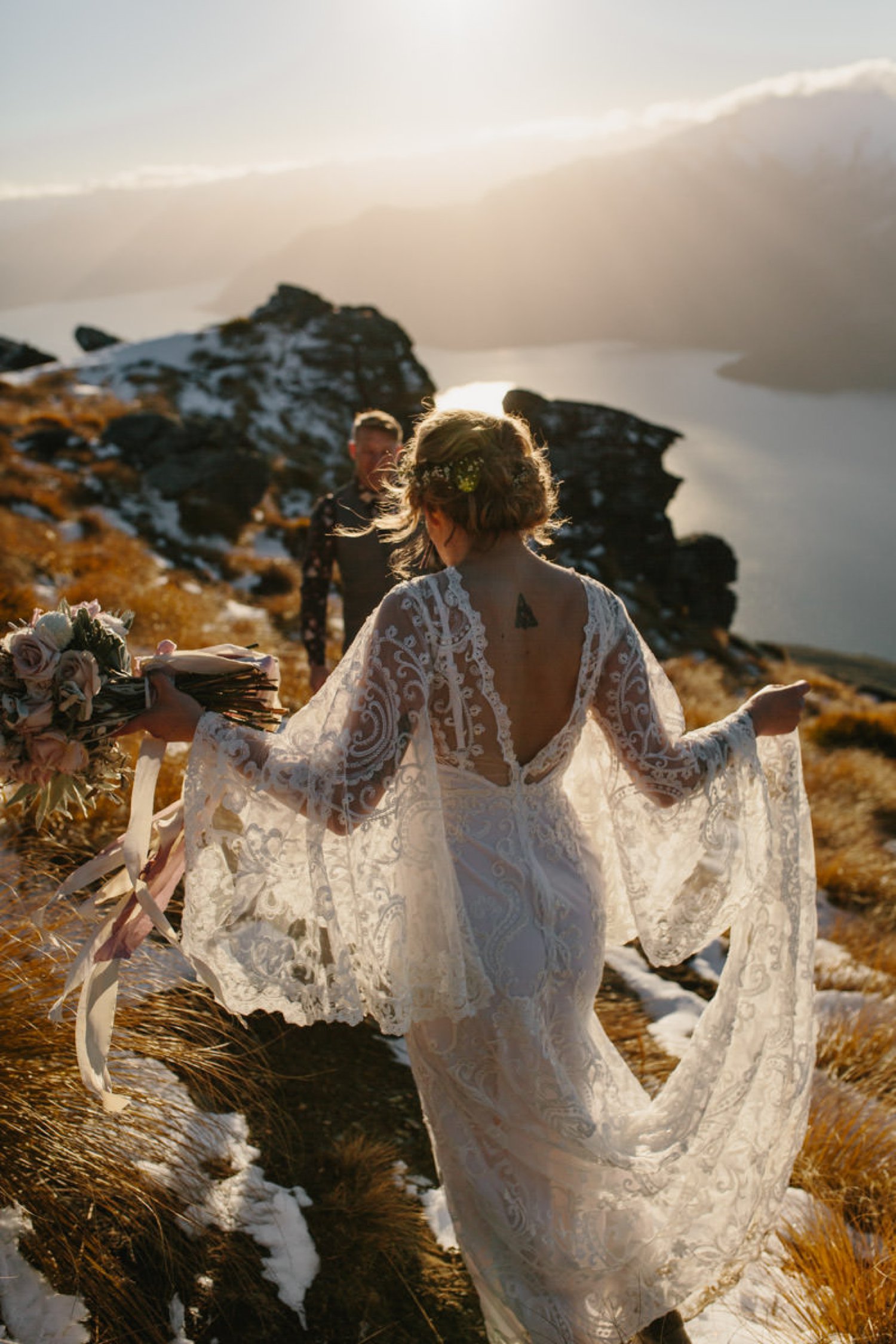 Bride wears The Maya gown by Brooke Tyson Ritual at her romantic New Zealand elopement by The Lovers Elopement Co
