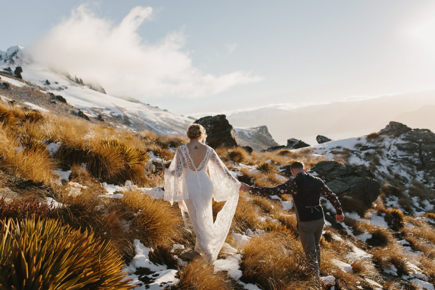 Bride and Groom during golden hour at their Cecil Peak Ledge Winter Helicopter Elopement by The Lovers Elopement co