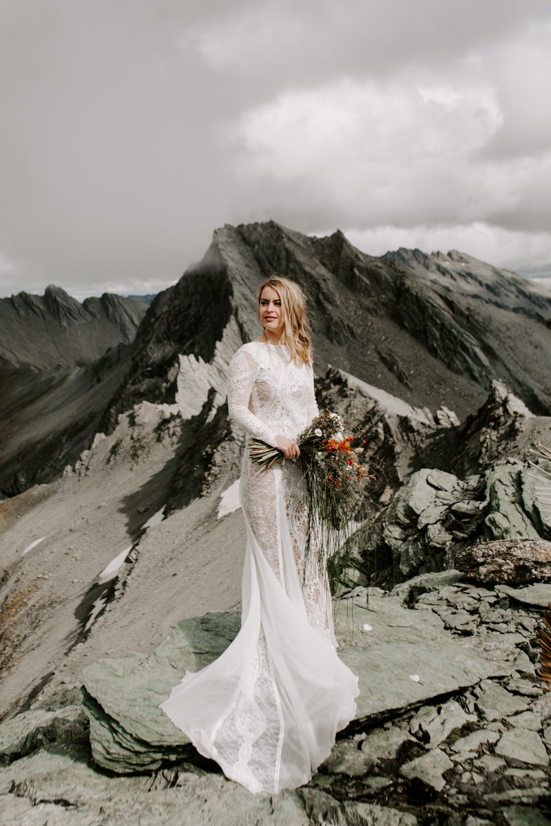 Bride wearing Grace Loves Lace dress at new Zealand Elopement wedding by The Lovers Elopement Co